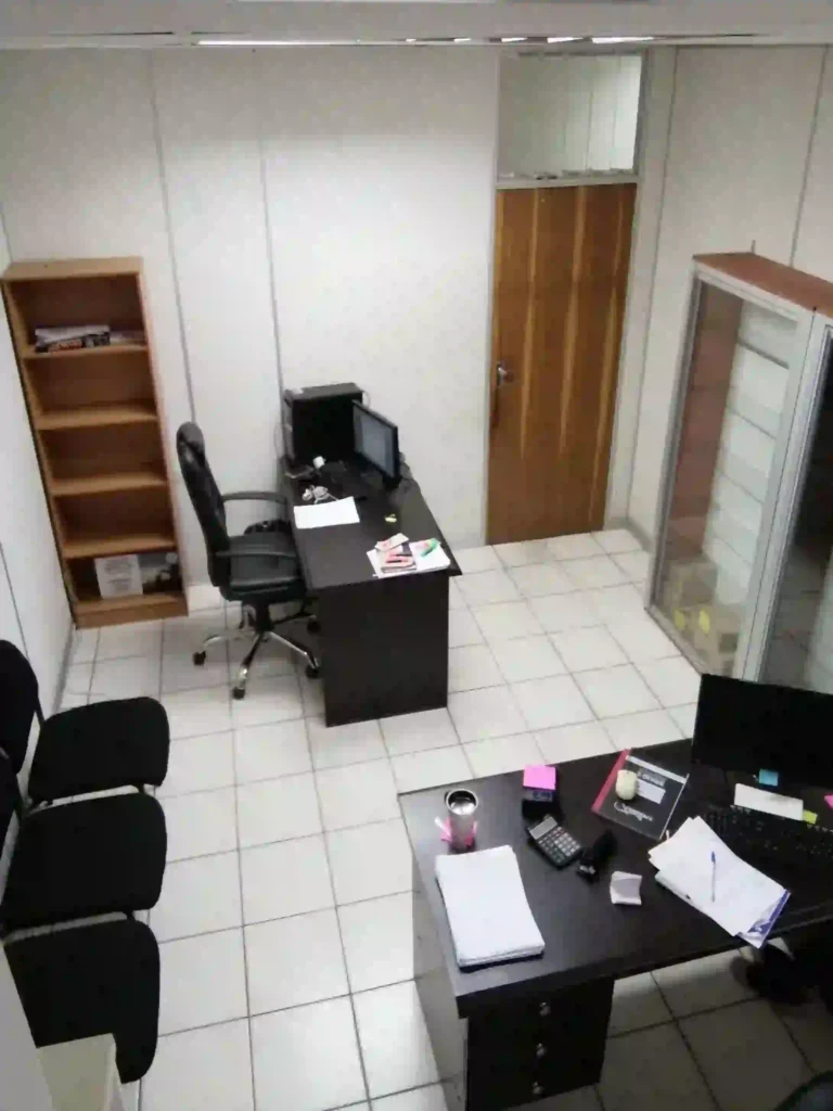 25 sqm two person smaller furnished office for hire with lockable door at Loapi House Gaborone showing two computers on desks with chairs in Loapi Business Centre