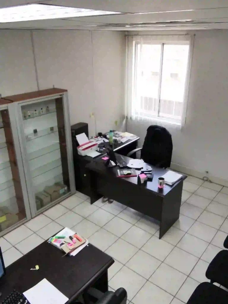 25 sqm two person smaller furnished start up office for hire with window at Loapi House Gaborone showing two computers on desks with chairs in Loapi Business Centre