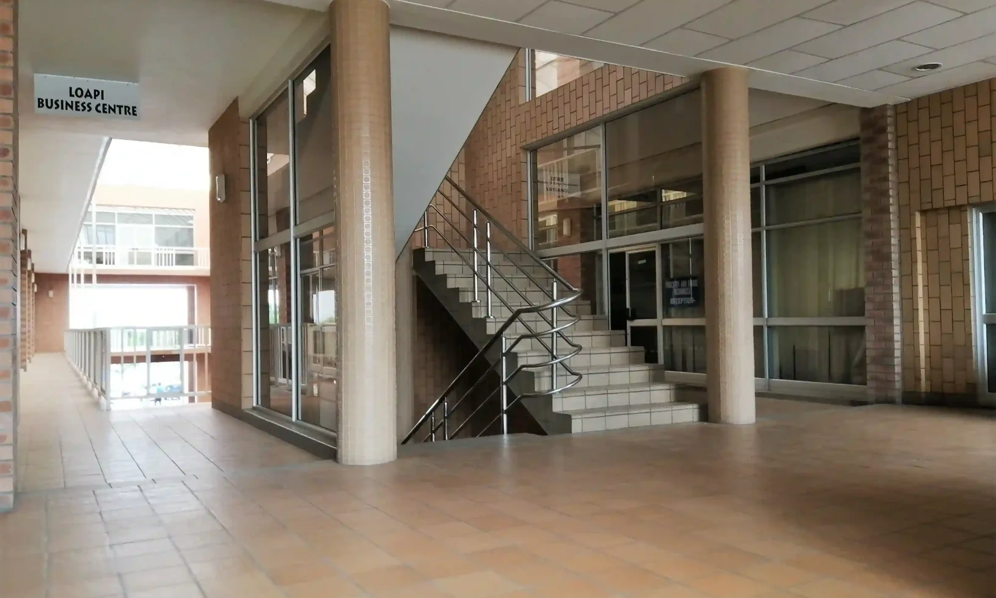 First floor stairs at Loapi House Gaborone Botswana accessing Loapi Business Centre with Forestry Range Resources and Immigration government departments
